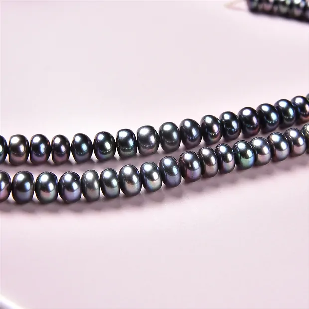 Button strand, freshwater pearl A, petrol (dyed), 04 x 06-07mm | Marco Schreier