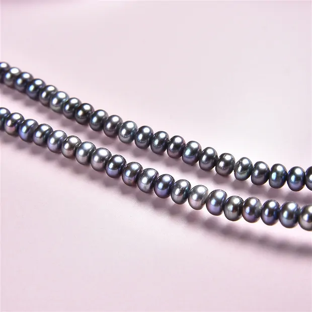 Collar de botones, perla de agua dulce petróleo (teñida), 03 x 05-06mm | Marco Schreier