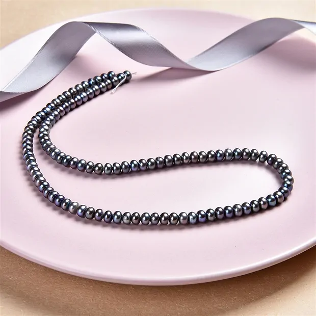 Collar de botones, perla de agua dulce petróleo (teñida), 03 x 05-06mm | Marco Schreier
