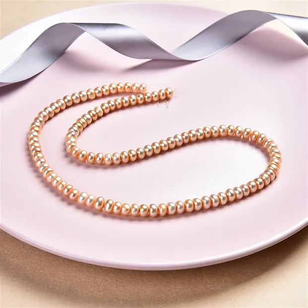 Collar de botones, perla de agua dulce salmón (natural), 03-04 x 05-06mm | Marco Schreier