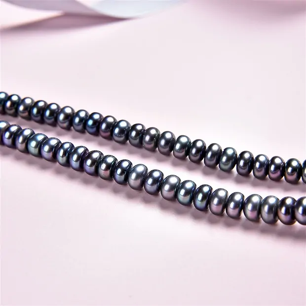 Button strand, freshwater pearl petrol (dyed), 03-04 x 05-06mm | Marco Schreier