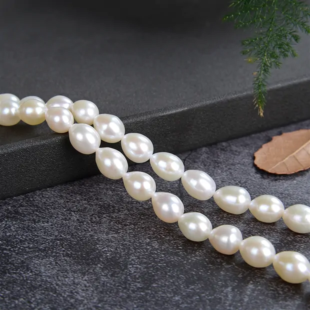 Drop strand, freshwater pearl, white-cream, 08 - 09mm | Marco Schreier