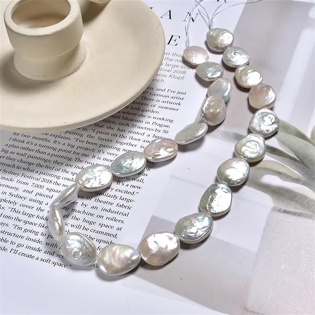 Strang Coin oval, Süßwasser-Perle, weiß-creme, 18 x 15mm | Marco Schreier