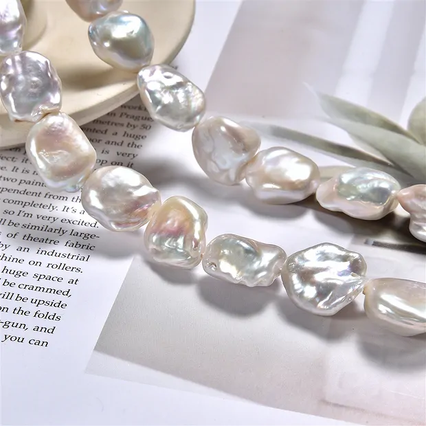 Strang Keshi, Süßwasser-Perle, creme-weiß, 17 x 14mm | Marco Schreier