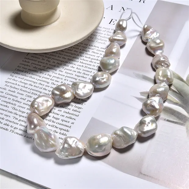 Keshi strand, freshwater pearl, cream-white, 17 x 14mm | Marco Schreier