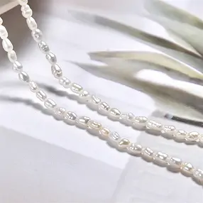 Rang de colliers Keshi, perle d'eau douce AB, blanc-crème, 09 - 12mm (39cm) | Marco Schreier