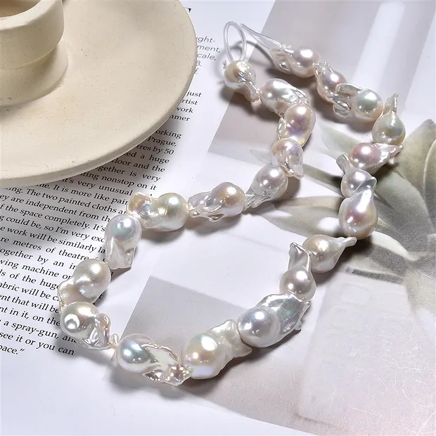 Rang de colliers perle baroque, perle d'eau douce, crème-blanc, 13-20 x 9-10mm | Marco Schreier