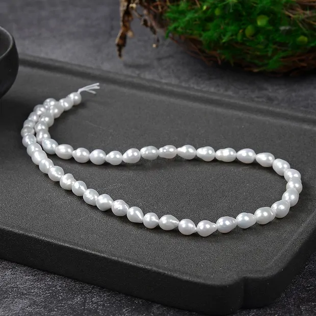 Drop strand, freshwater pearl, white-cream, 06 - 07mm | Marco Schreier