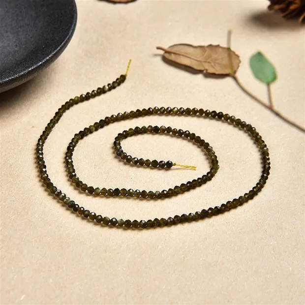 String Beads, Obsidian (gold luster obsidian), faceted, 02mm | Marco Schreier