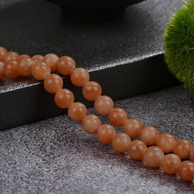 Strang Kugeln, Calcit (rot-orange), 06mm (39cm) | Marco Schreier