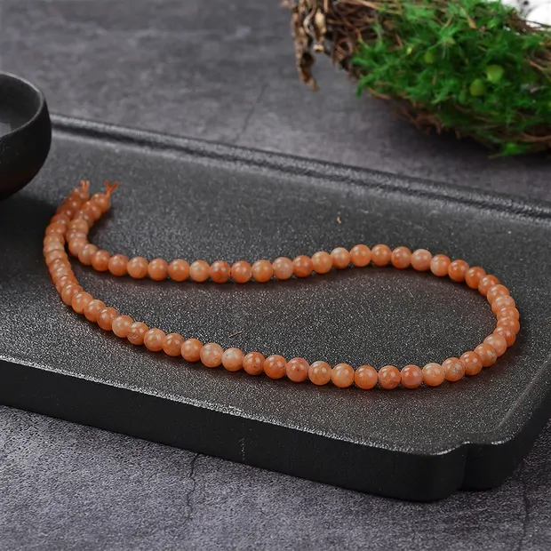 Rang de collier boules, Calcite (rouge-orange), 06mm (39cm) | Marco Schreier