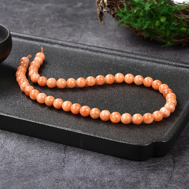 Rang de collier boules, Calcite (rouge-orange), 08mm (39cm) | Marco Schreier