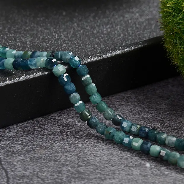 Strand cube, indigolite, faceted, 03 x 03 x 03mm (39cm) | Marco Schreier