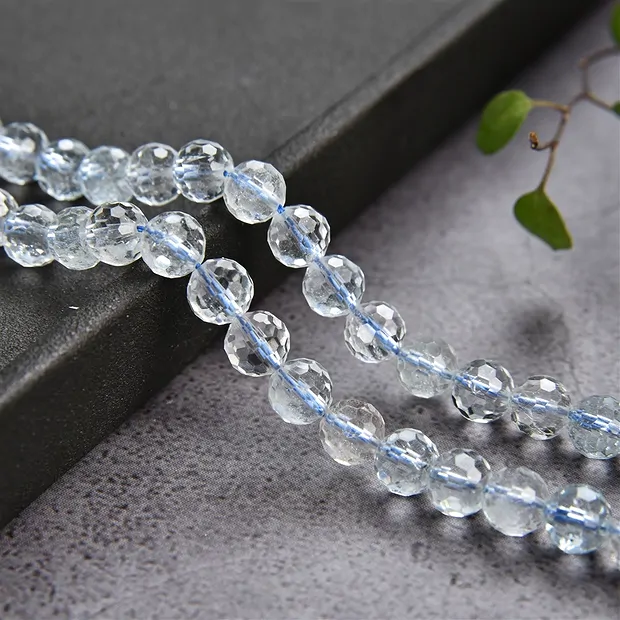 Rang de collier boules, Topaze (blanc-bleu) A, à facettes, 06mm (39cm) | Marco Schreier