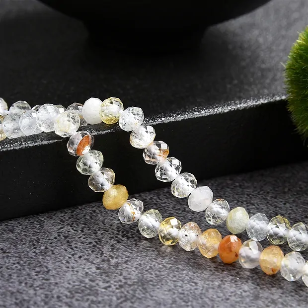 Collar de botones, topacio (de color), 03 x 05mm, facetado (39cm) | Marco Schreier