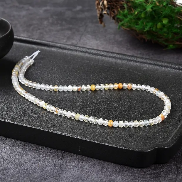 Collar de botones, topacio (de color), 03 x 05mm, facetado (39cm) | Marco Schreier