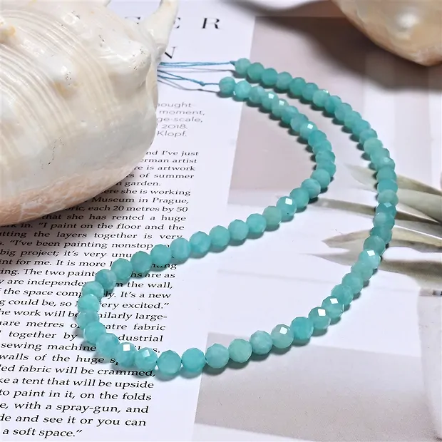 String Beads, Amazonite (light), faceted, 06mm (39cm) | Marco Schreier