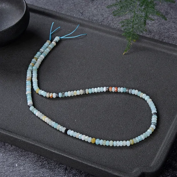Cordón botón, amazonita (de color), facetado, 02 x 04mm | Marco Schreier