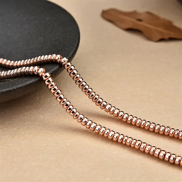Strand button, hematin rose gold (dyed), 02 x 03mm | Marco Schreier
