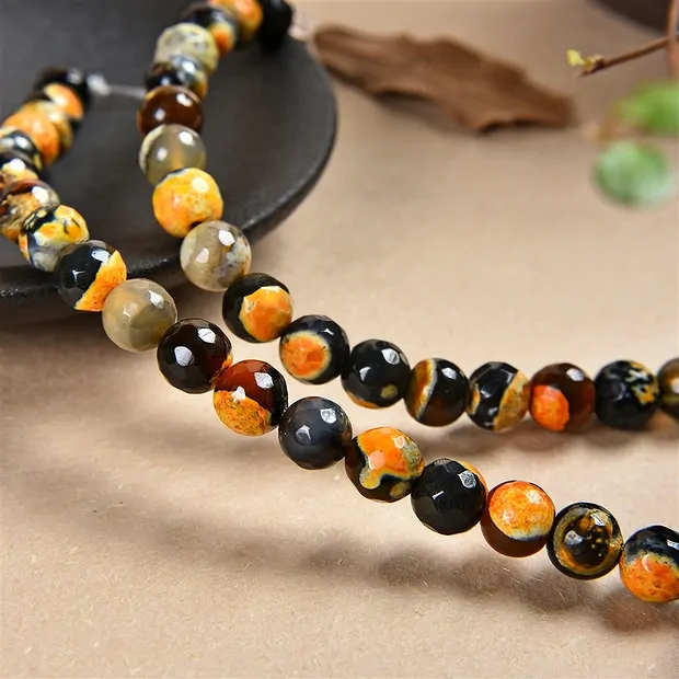 String Beads, Agate (Sunset) orange (dyed), faceted, 08mm | Marco Schreier