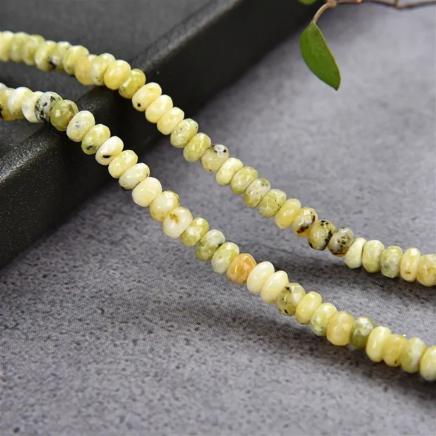 Button strand, Serpentine (Lizardite), faceted, 02 x 04mm | Marco Schreier