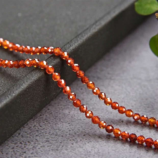 Strang Kugeln, Cubic Zirkonia orange (synt.), facettiert, 03mm (38cm) | Marco Schreier