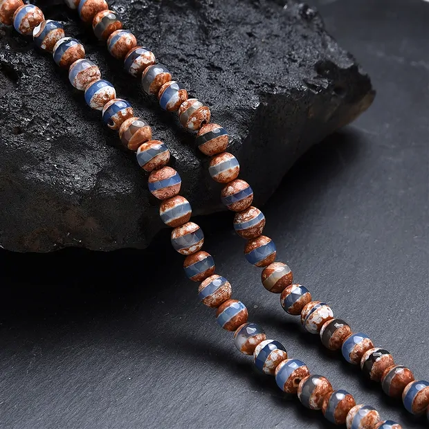 Rang de collier boules, Agate (Agate de Mongolie brun-blanc-bleu), 06mm, à facettes (36cm) | Marco Schreier