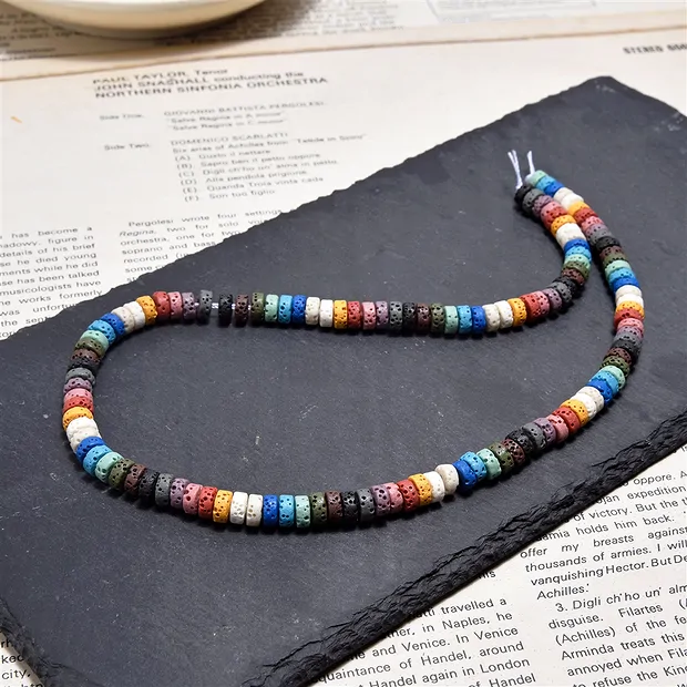 Strand cylinder "Heishi", lava (colorful), 06 x 03mm | Marco Schreier