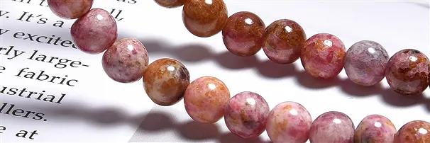 Gemstone strands Rhodonite | minerals wholesale - gems, healing stones & jewelry