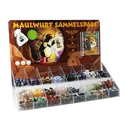 Espositore con varie pietre burattate | grossista gemme e pietre curative