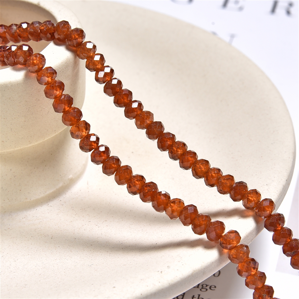 Button strand, Hessonite (garnet), faceted, 03 x 04mm (39cm) | Marco Schreier