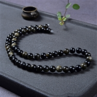Strand of beads, obsidian (gold luster obsidian), 06mm